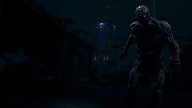 A screenshot from Dying Light 2 showing a zombie with glowing eyes in a city at night
